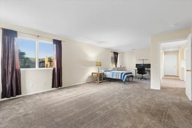 a view of a livingroom with furniture and a window