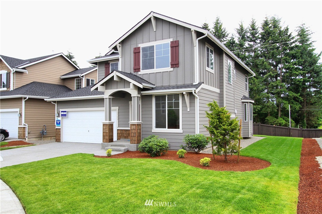 16302 5th Avenue Southeast Bothell, WA 98012 - Photo 1 of 1 a front view of a house with a yard and garage