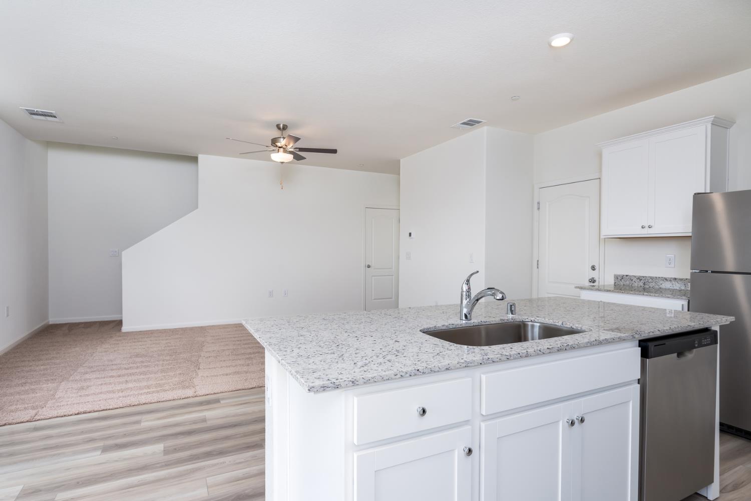 2259 Travis Court Newman, CA 95360 - Photo 4 of 17 a kitchen with a sink and cabinets