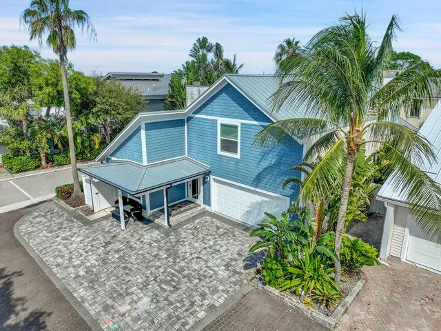 an aerial view of a house with a garden