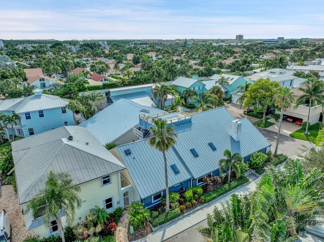 an aerial view of a house with a garden