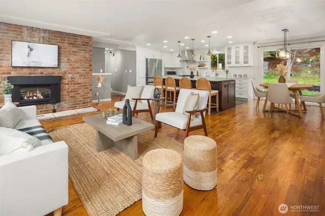 a living room with fireplace furniture and a fireplace