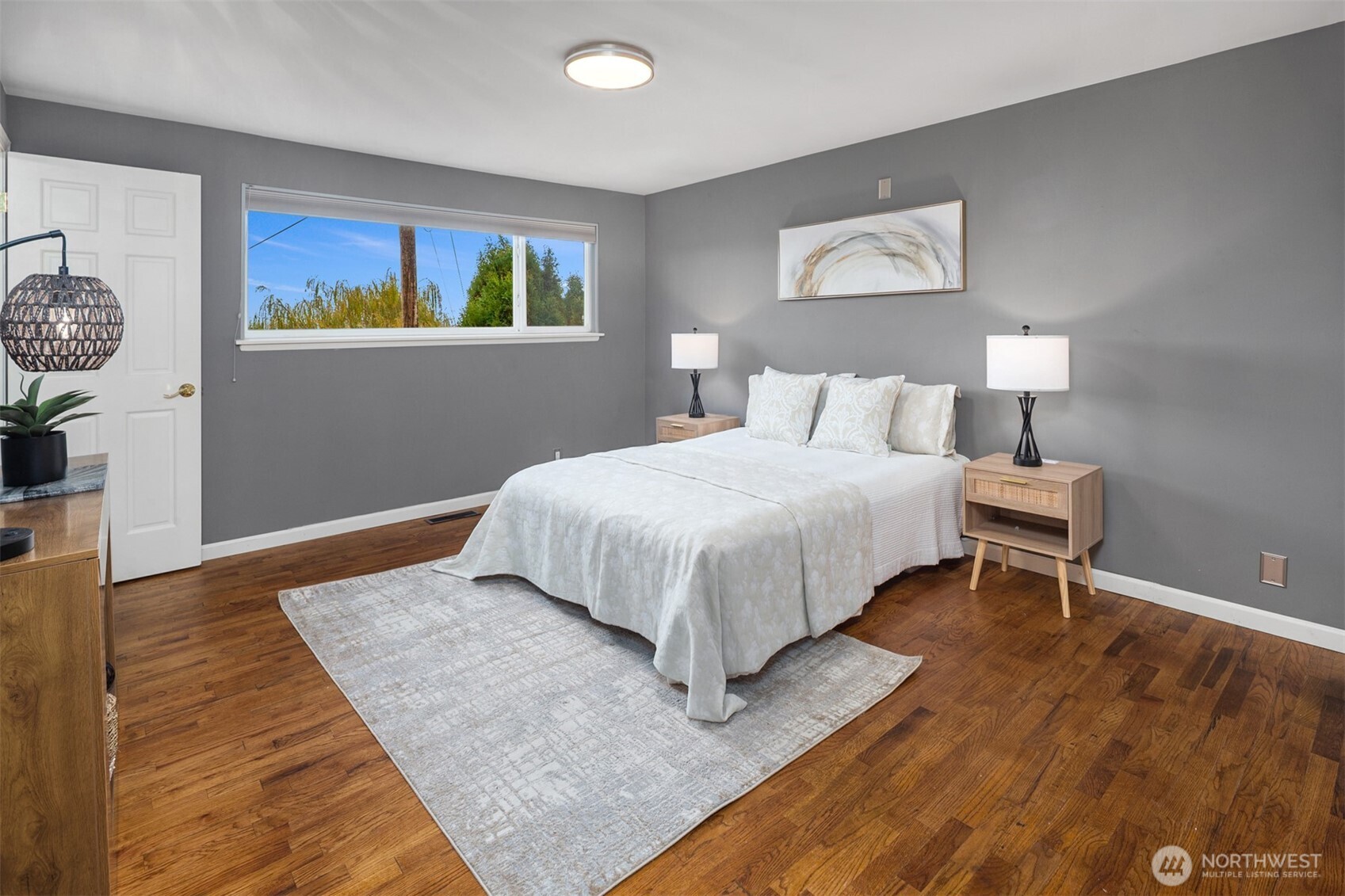 1221 Coronado Place Edmonds, WA 98020 - Photo 19 of 32 a bedroom with a bed and painting on the wall