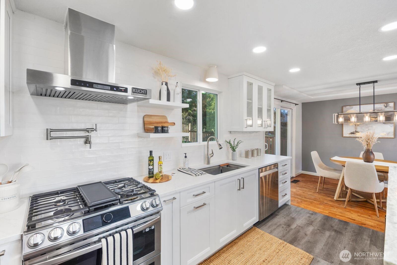 1221 Coronado Place Edmonds, WA 98020 - Photo 5 of 32 a open kitchen with stainless steel appliances granite countertop a stove and a sink