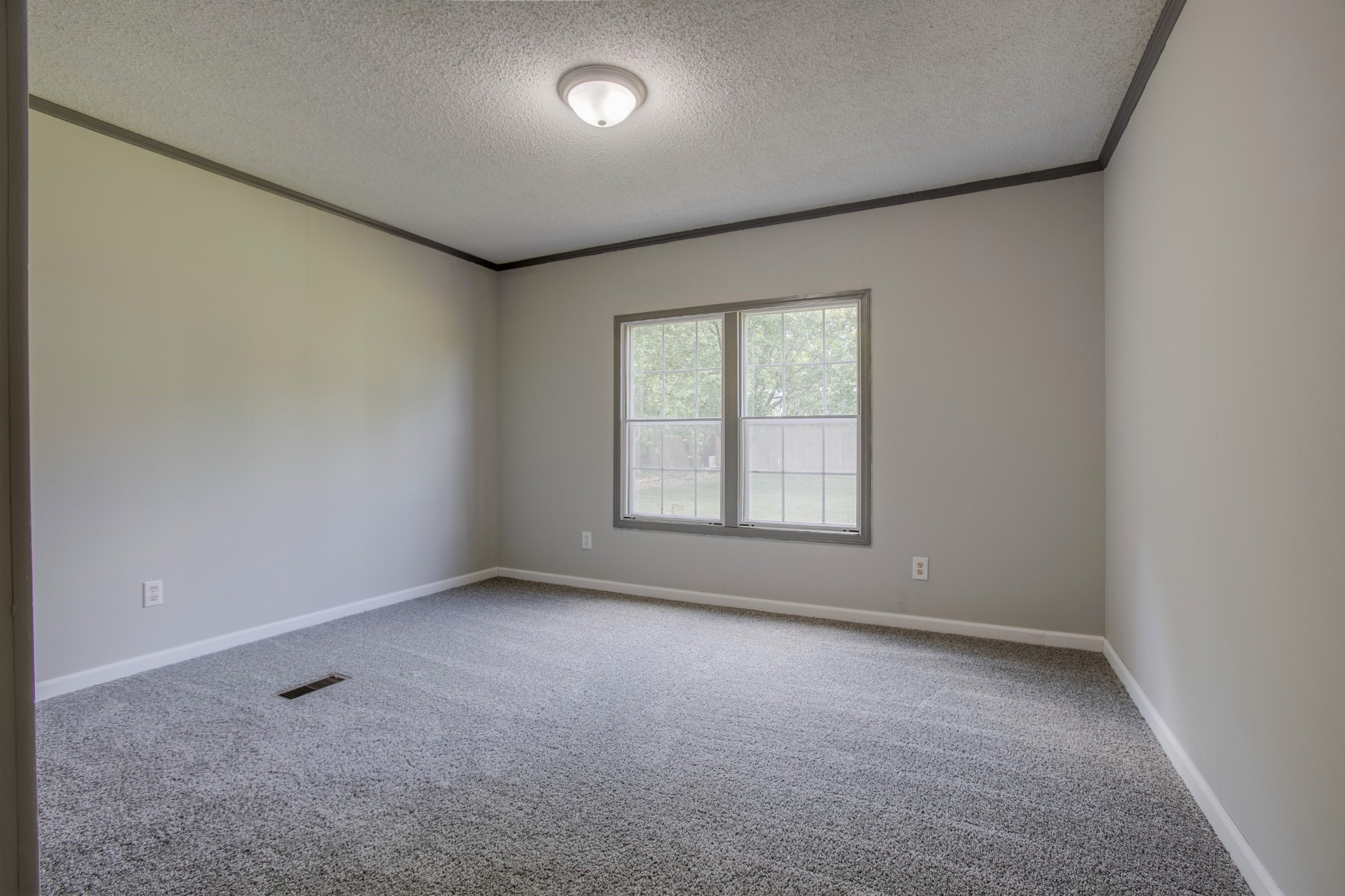 4809 Ollie Chunn Road Spring Hill, TN 37174 - Photo 22 of 27 an empty room with a empty space and windows