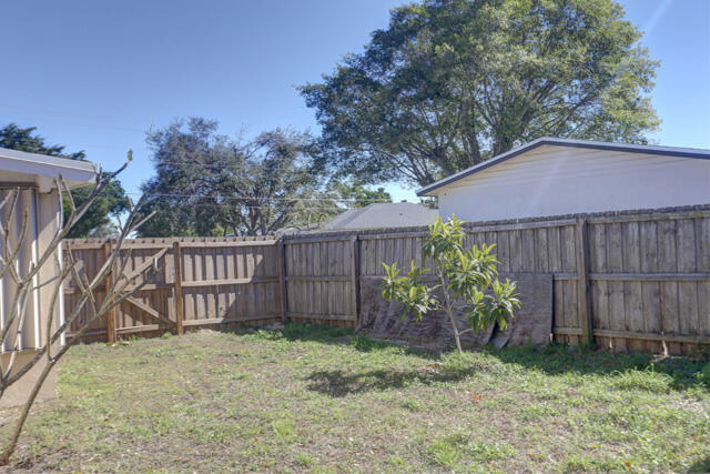 910 9th Street Lake Park, FL 33403 - Photo 17 of 34 Backyard view toward front 910 9th St