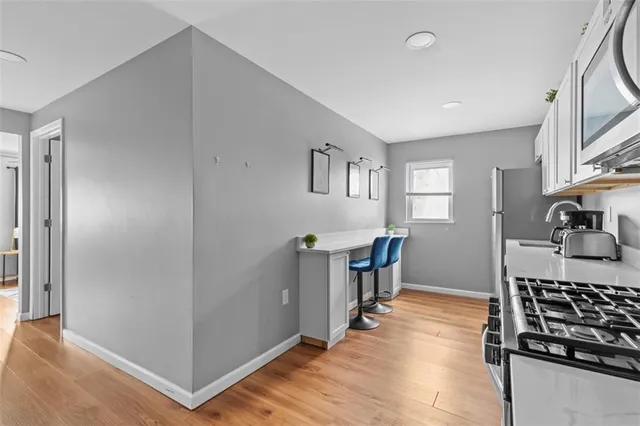 a kitchen with sink cabinets and stove
