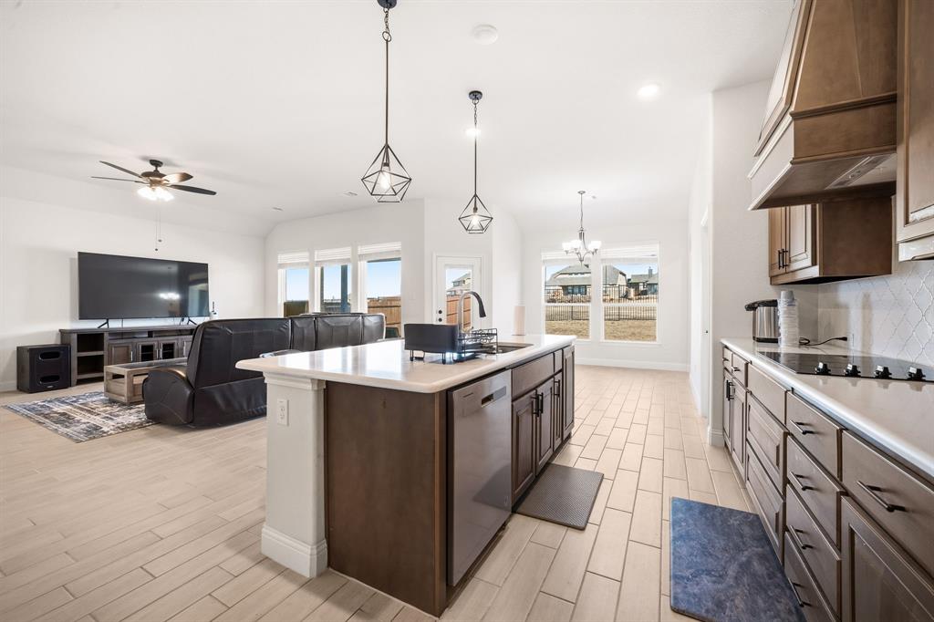 3841 Eagles Bluff Road Midlothian, TX 76065 - Photo 11 of 36 a large kitchen with stainless steel appliances granite countertop a stove and a sink