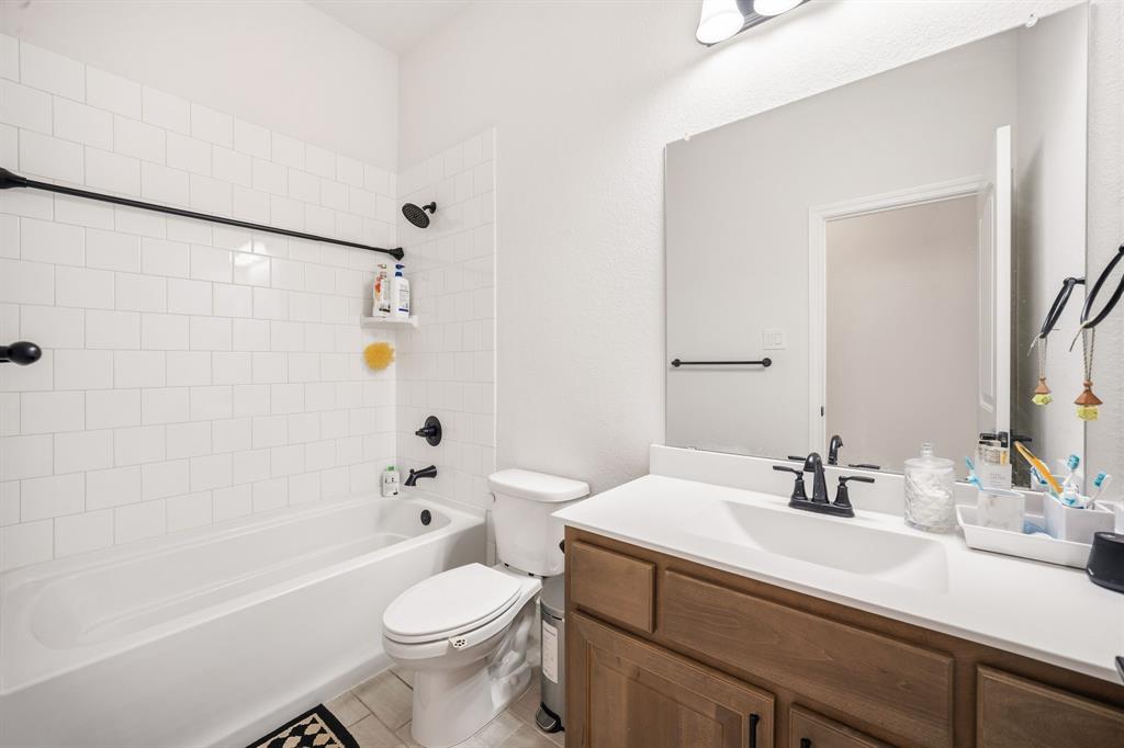 3841 Eagles Bluff Road Midlothian, TX 76065 - Photo 24 of 36 a bathroom with a sink a toilet and shower