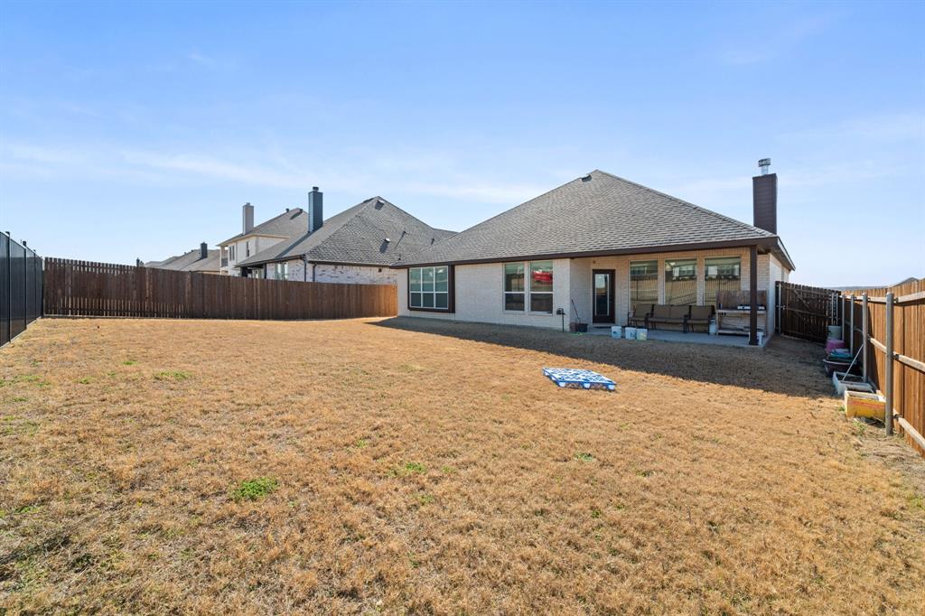3841 Eagles Bluff Road Midlothian, TX 76065 - Photo 27 of 36 a front view of a house with a yard