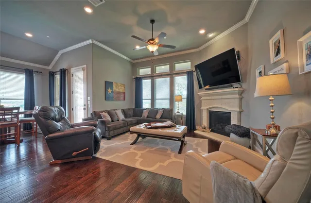 a living room with furniture fireplace and flat screen tv