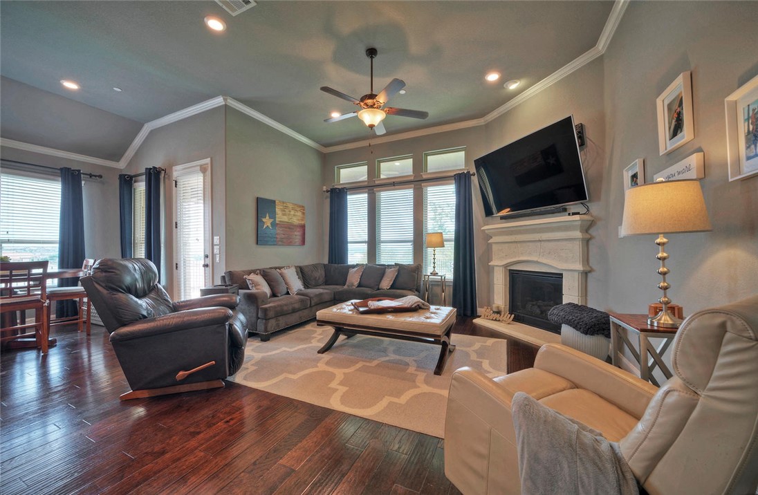 101 Maxwell Way Austin, TX 78738 - Photo 11 of 40 a living room with furniture fireplace and flat screen tv