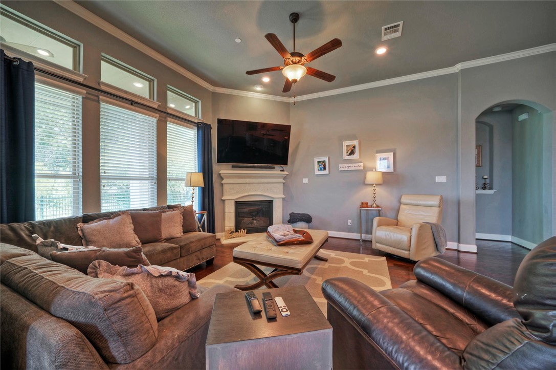 101 Maxwell Way Austin, TX 78738 - Photo 12 of 40 a living room with furniture fireplace and a flat screen tv