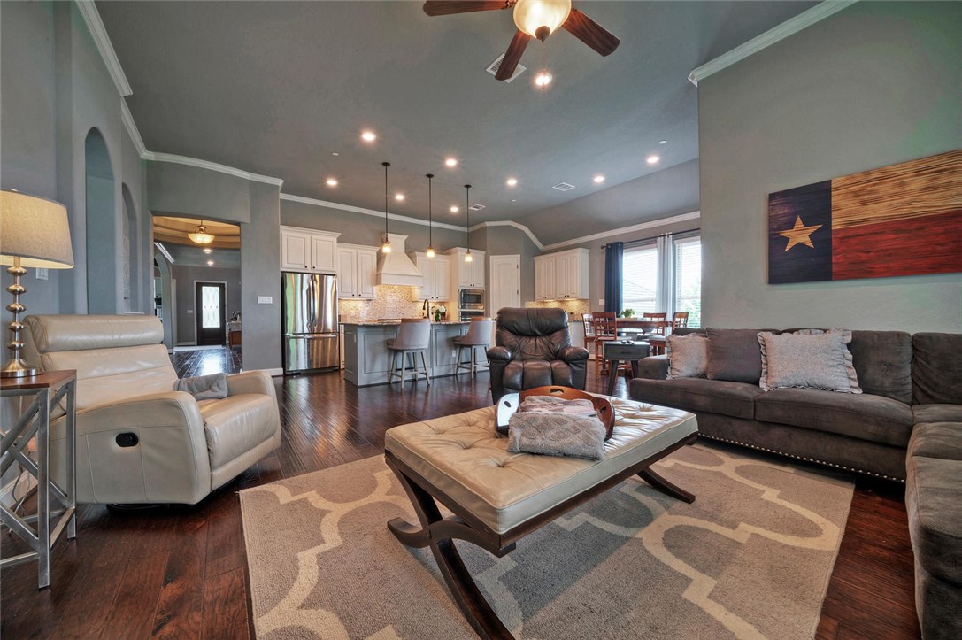 101 Maxwell Way Austin, TX 78738 - Photo 13 of 40 a living room with furniture and a wooden floor