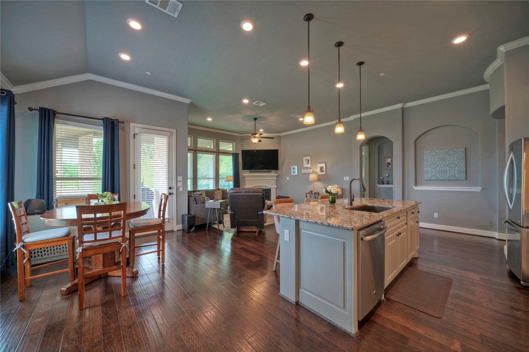 101 Maxwell Way Austin, TX 78738 - Photo 17 of 40 a kitchen with lots of counter top space and wooden floor
