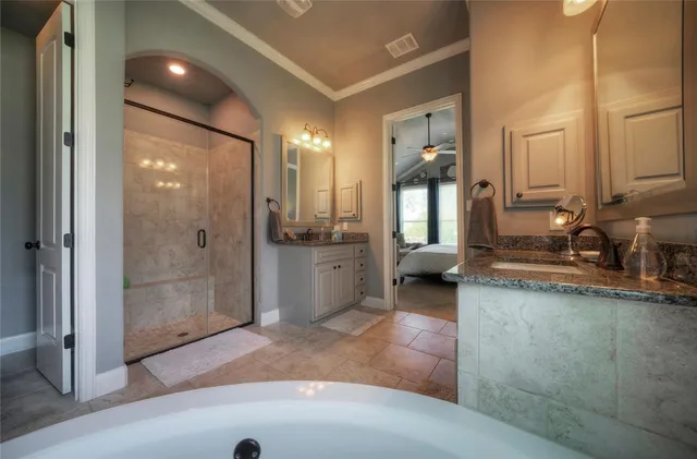 a bathroom with mirror and shower