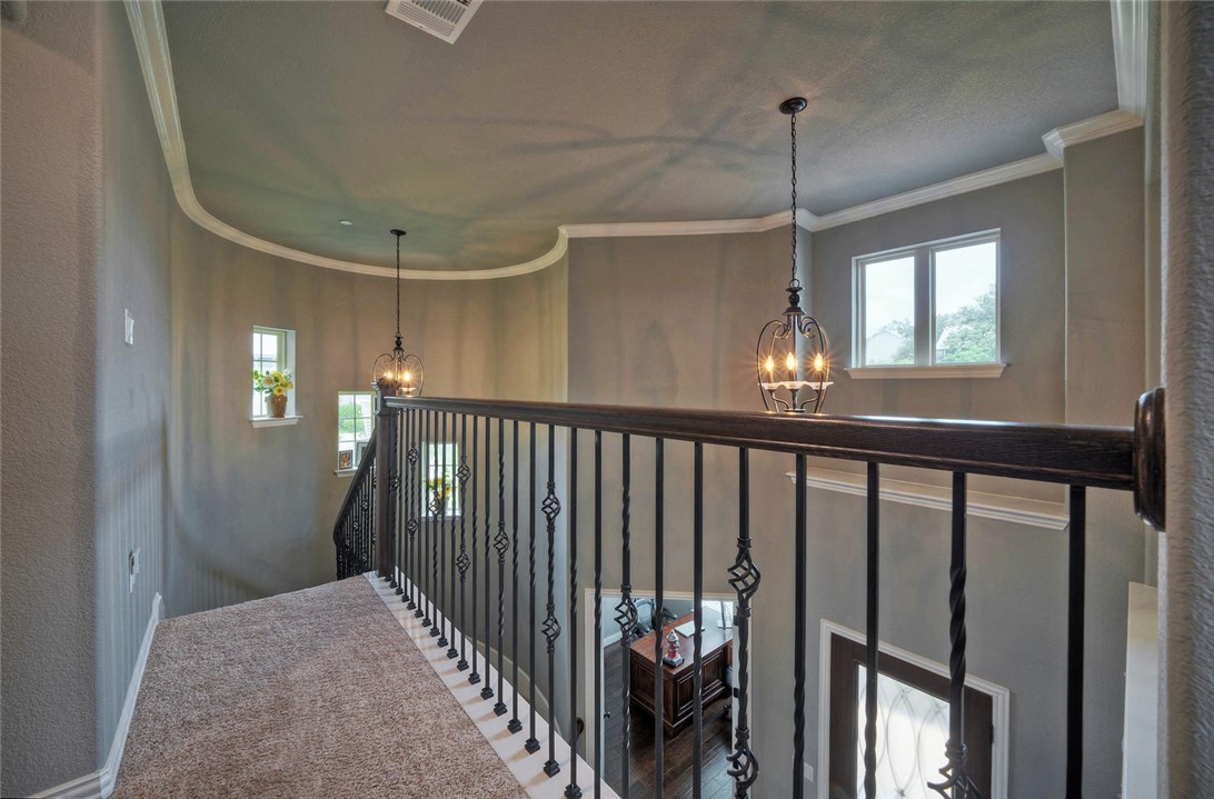 101 Maxwell Way Austin, TX 78738 - Photo 27 of 40 a view of a hallway with windows