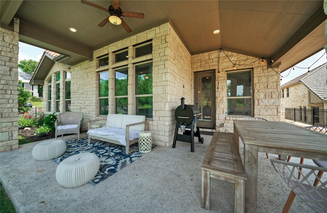 101 Maxwell Way Austin, TX 78738 - Photo 34 of 40 a view of a patio with table and chairs and potted plants
