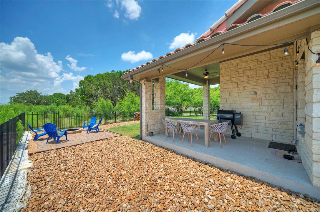 101 Maxwell Way Austin, TX 78738 - Photo 35 of 40 a view of a porch with chairs and potted plants