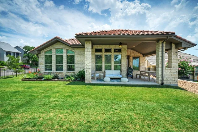 a view of a house with a garden and porch