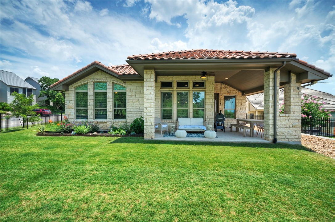 101 Maxwell Way Austin, TX 78738 - Photo 37 of 40 a view of a house with a garden and porch