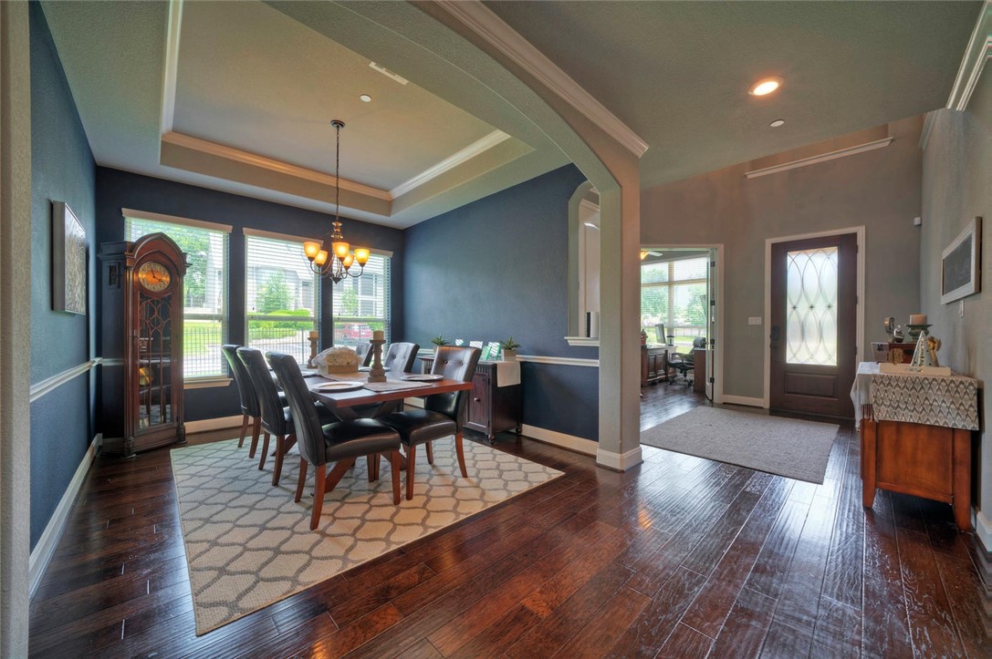 101 Maxwell Way Austin, TX 78738 - Photo 8 of 40 a view of a dining room with furniture and wooden floor