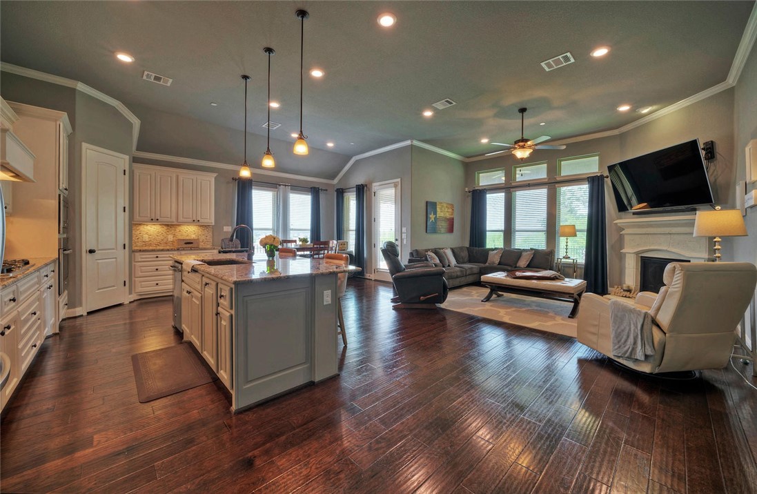 101 Maxwell Way Austin, TX 78738 - Photo 10 of 40 a living room with furniture and a flat screen tv