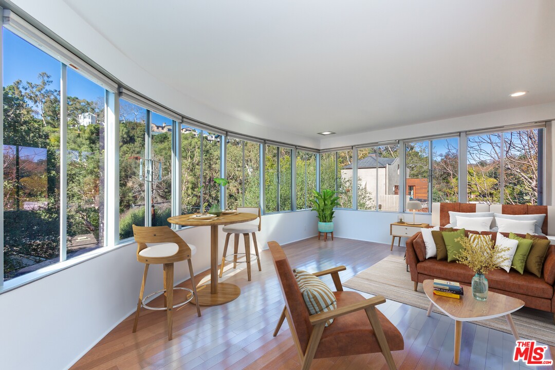 491 Mesa Road Santa Monica, CA 90402 - Photo 5 of 24 a living room with furniture and a large window