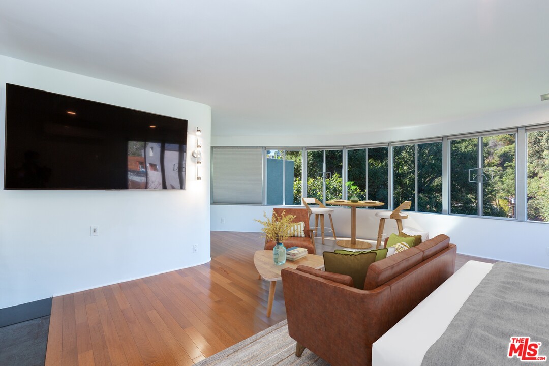491 Mesa Road Santa Monica, CA 90402 - Photo 9 of 24 a living room with furniture and a flat screen tv