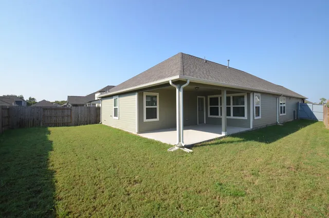 a house with garden in front of it