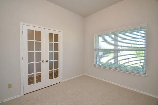 a view of an empty room with a window