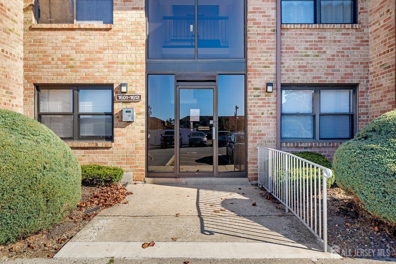 1609 Raspberry Court Edison, NJ 08817 - Photo 1 of 18 a view of a house with a door and a floor to ceiling window