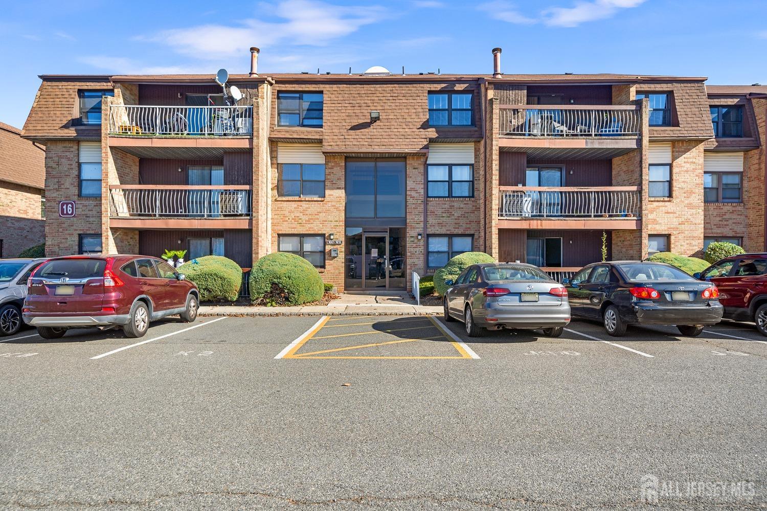 1609 Raspberry Court Edison, NJ 08817 - Photo 2 of 18 a car parked in front of a big building