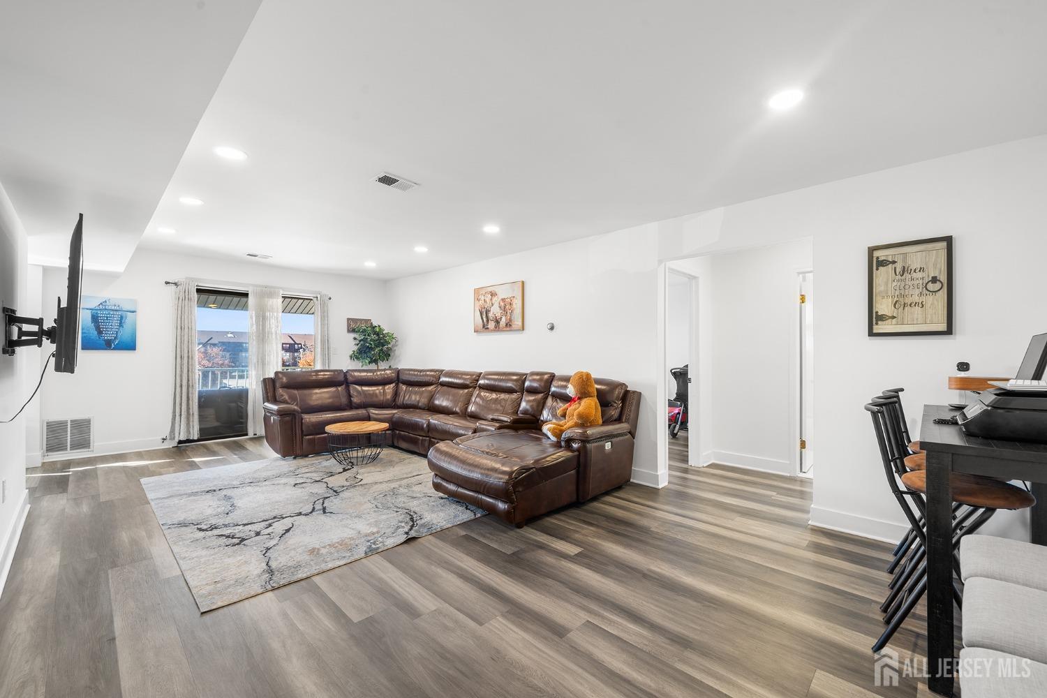 1609 Raspberry Court Edison, NJ 08817 - Photo 5 of 18 a living room with furniture and a wooden floor
