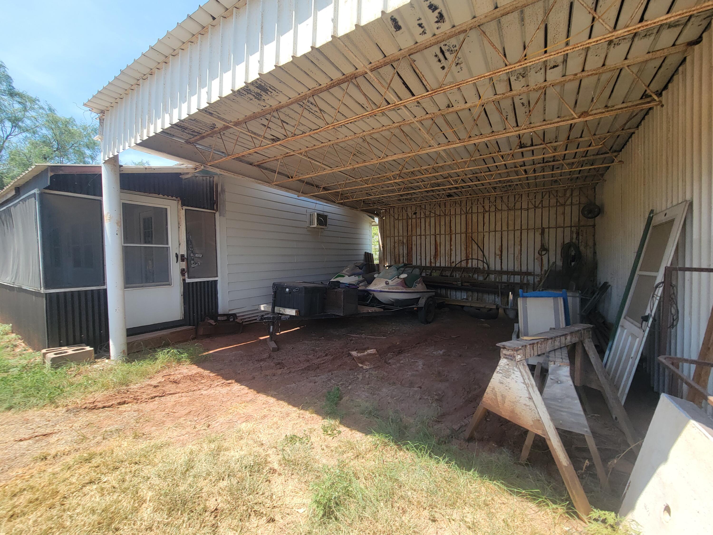 132 Pr 621 Haskell, TX 79521 - Photo 17 of 19 a room with wooden furniture