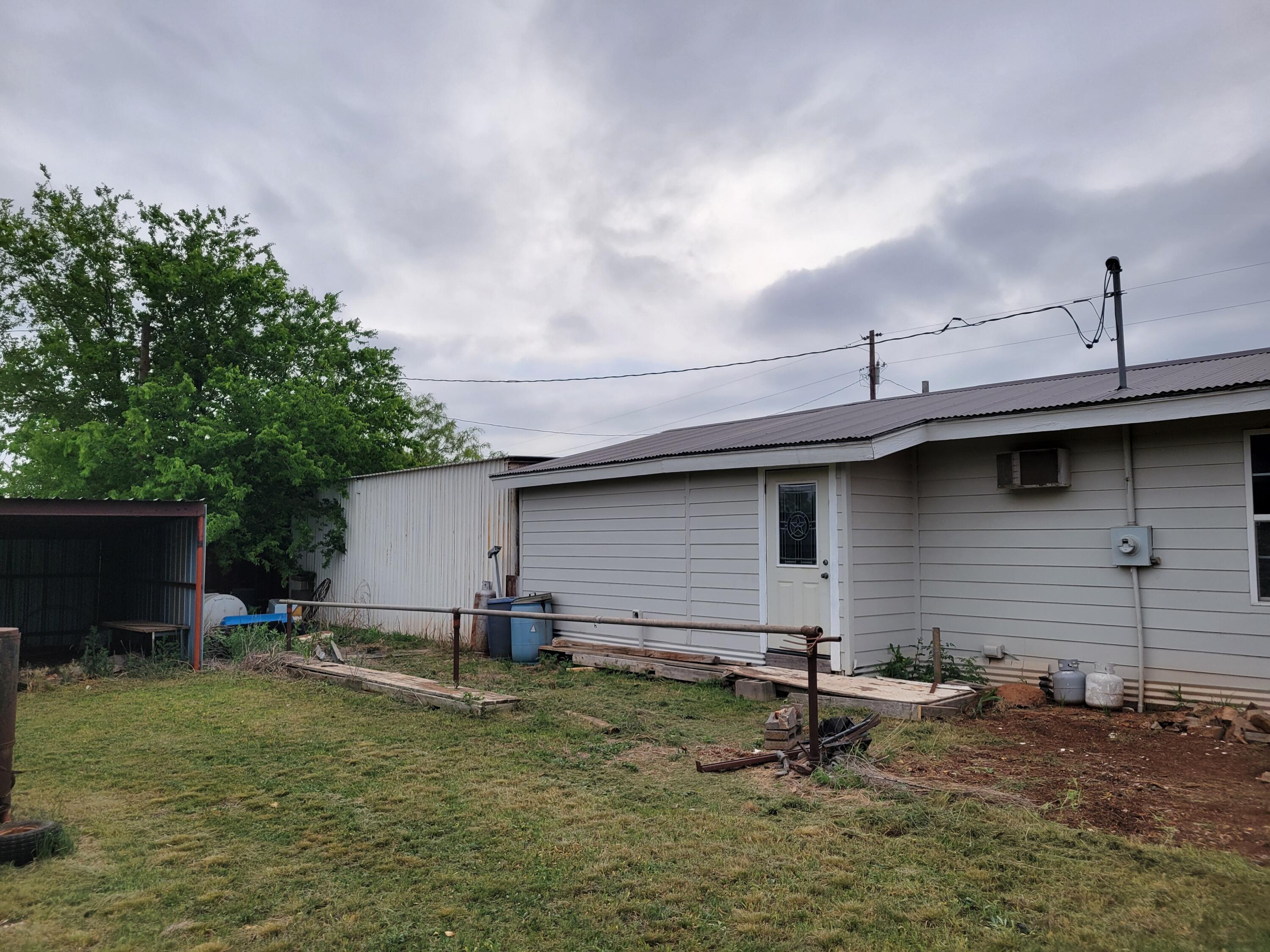 132 Pr 621 Haskell, TX 79521 - Photo 18 of 19 a backyard of a house with table and chairs