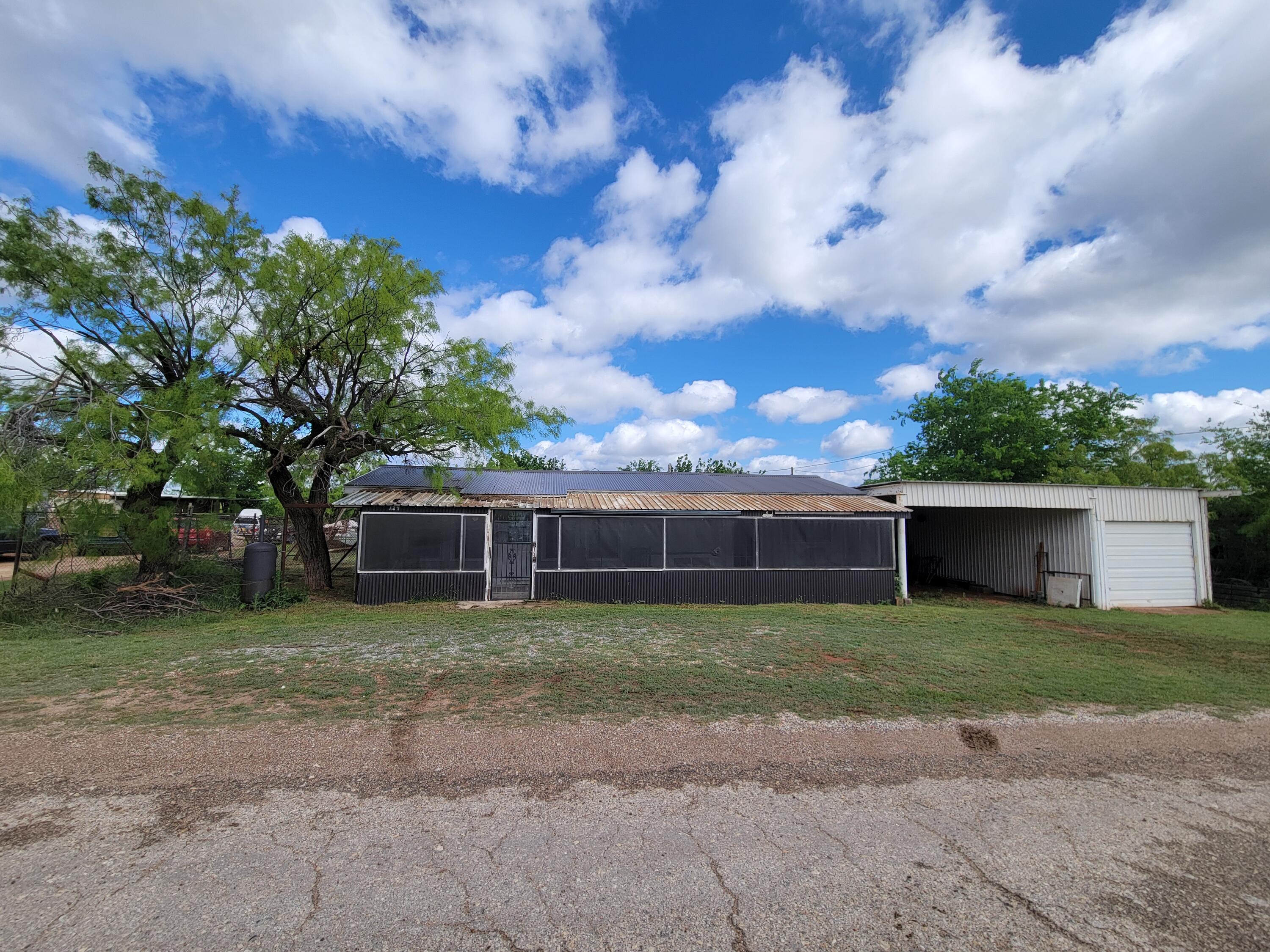 132 Pr 621 Haskell, TX 79521 - Photo 3 of 19 a view of a house with a yard and large trees