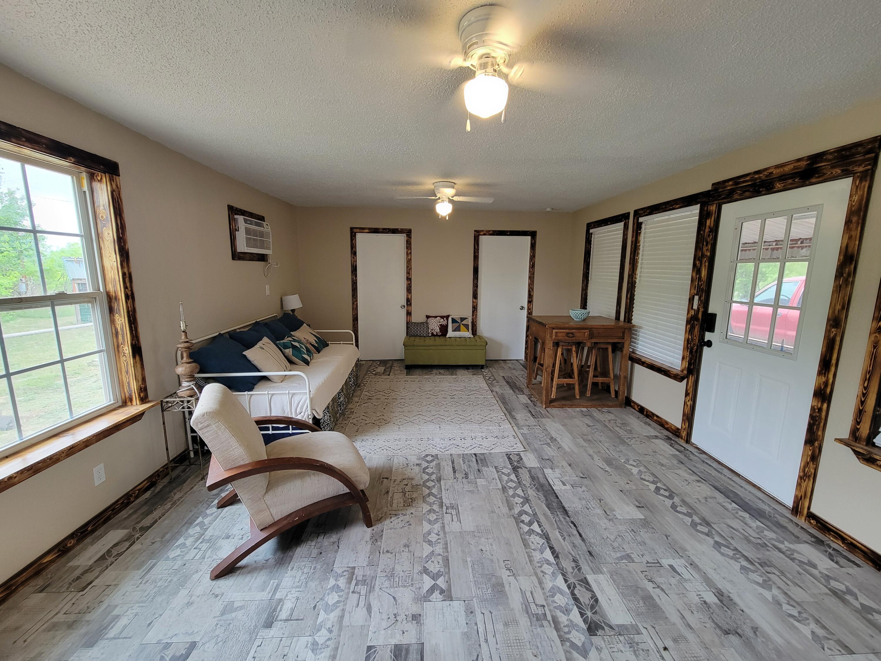 132 Pr 621 Haskell, TX 79521 - Photo 5 of 19 a living room with furniture and a wooden floor