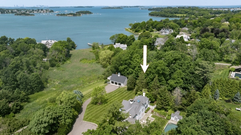 an aerial view of a houses with outdoor space and lake view