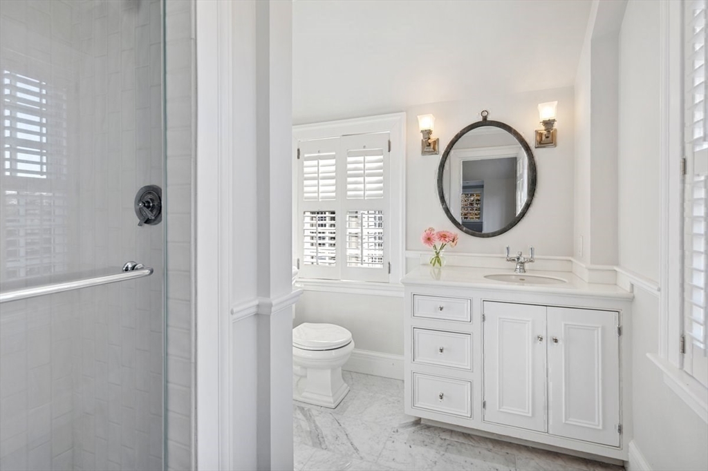 10 R Martins Lane Hingham, MA 02043 - Photo 23 of 40 a bathroom with a toilet a sink and a mirror