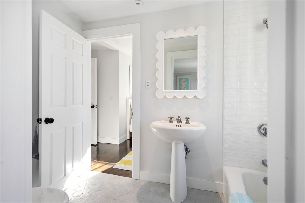 10 R Martins Lane Hingham, MA 02043 - Photo 26 of 40 a bathroom with a sink a toilet and shower