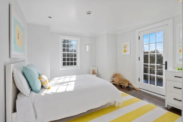 a kitchen with stainless steel appliances granite countertop a refrigerator a sink a stove and wooden floor