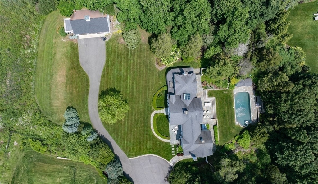 10 R Martins Lane Hingham, MA 02043 - Photo 3 of 40 an aerial view of a house with a backyard space and trees all around