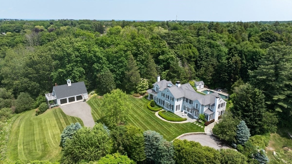 10 R Martins Lane Hingham, MA 02043 - Photo 4 of 40 an aerial view of a house with a garden