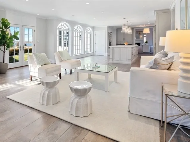 a kitchen with stainless steel appliances white cabinets and a window