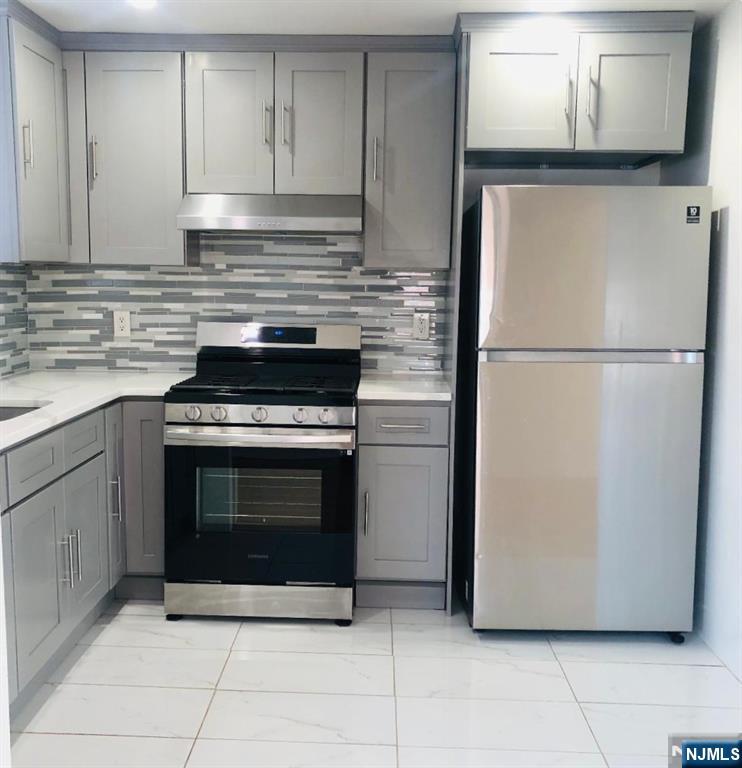 460 Club Way, Unit 43 Hackensack, NJ 07601 - Photo 4 of 10 a kitchen with cabinets and stainless steel appliances