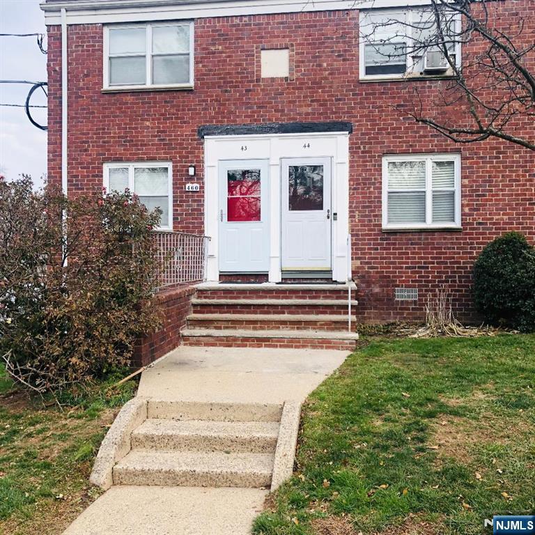 460 Club Way, Unit 43 Hackensack, NJ 07601 - Photo 10 of 10 a view of a brick house with a yard and plants