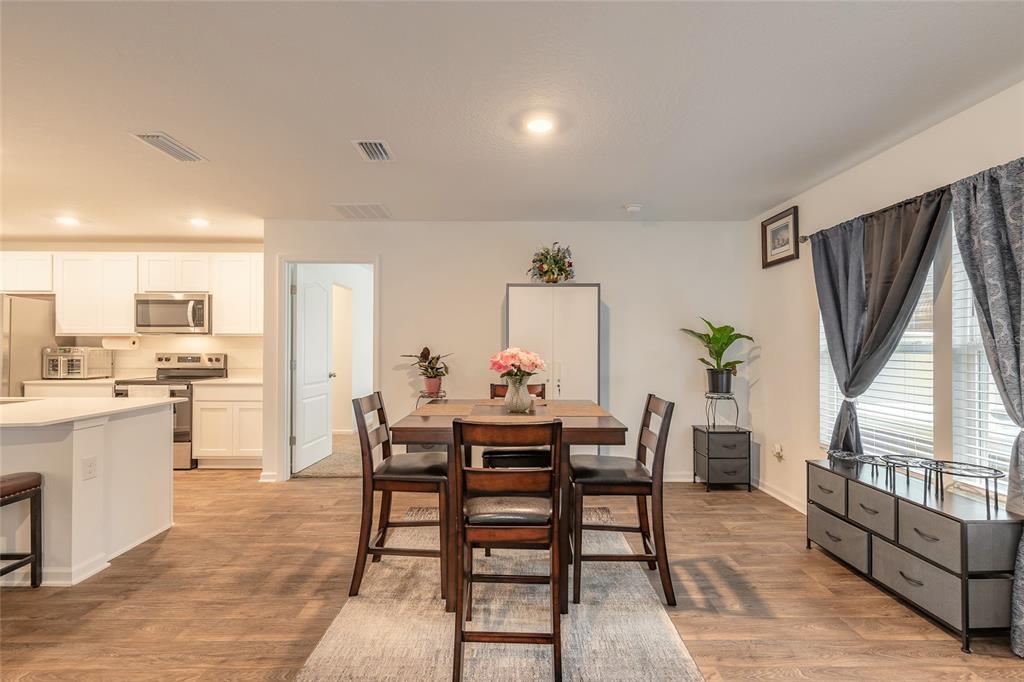 82 Hulett Wds Road Palm Coast, FL 32137 - Photo 12 of 48 a dining room with furniture and window