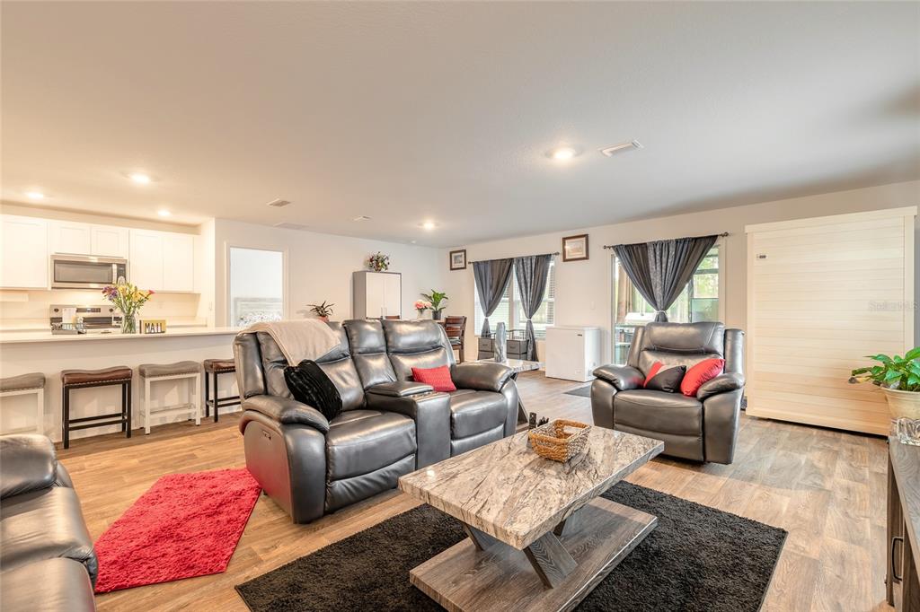 82 Hulett Wds Road Palm Coast, FL 32137 - Photo 14 of 48 a living room with furniture and a wooden floor