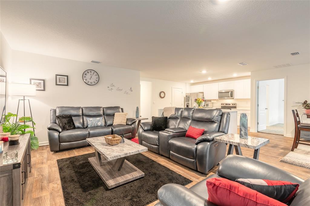 82 Hulett Wds Road Palm Coast, FL 32137 - Photo 15 of 48 a living room with furniture and view of kitchen